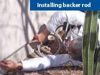 pest control tech installing pest control device