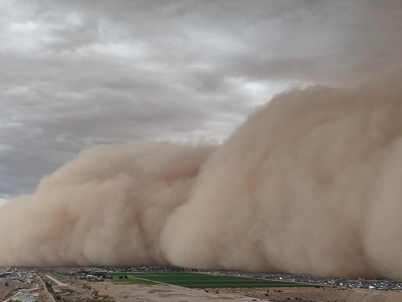 sand storm sweeping over a city